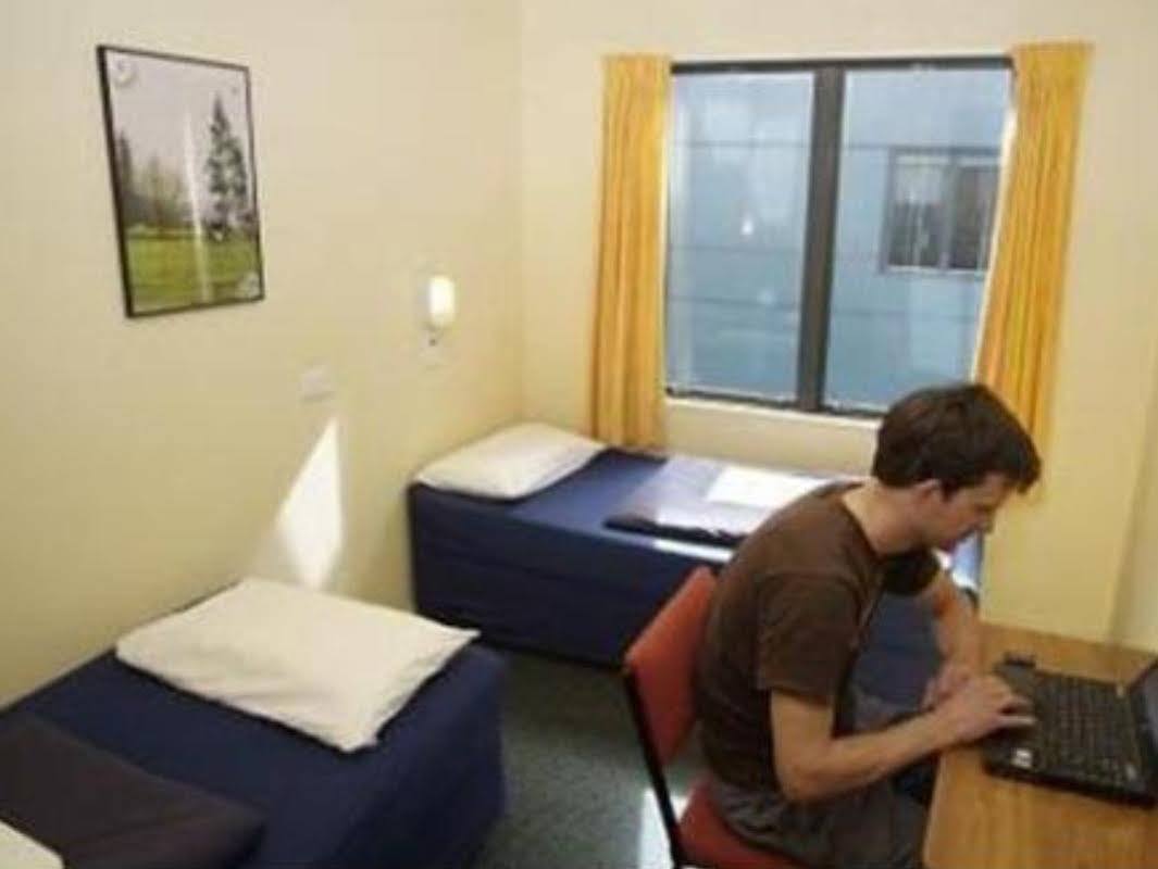 Haka House Wellington Hostel Eksteriør bilde A student working in his room at the International House